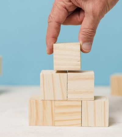 businessman-using-wooden-pieces